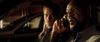 Movie still from “Gone in 60 Seconds” (2000), directed by Dominic Sena – A man sitting next to another man in a car; Close Up shot, Over the shoulder angle