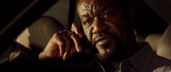 Movie still from “Gone in 60 Seconds” (2000), directed by Dominic Sena – An older man is talking on a cell phone; Close Up shot, Low angle