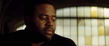 Movie still from “Gone in 60 Seconds” (2000), directed by Dominic Sena – A person with a beard looking to his left; Close Up shot, Low angle