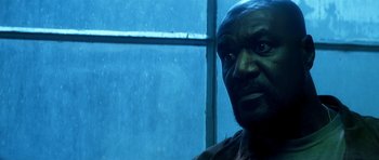 Movie still from “Gone in 60 Seconds” (2000), directed by Dominic Sena – A man's face in front of a window; Close Up shot, Low angle