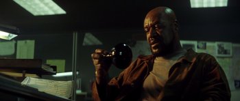 Movie still from “Gone in 60 Seconds” (2000), directed by Dominic Sena – A man holding a wine glass in his hand; Close Up shot, Low angle