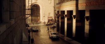 Movie still from “Gone in 60 Seconds” (2000), directed by Dominic Sena – A street scene with cars parked on the side of the road; Extreme Wide shot, High angle