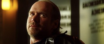 Movie still from “Gone in 60 Seconds” (2000), directed by Dominic Sena – A person wearing a leather jacket; Close Up shot, Low angle