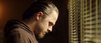 Movie still from “Gone in 60 Seconds” (2000), directed by Dominic Sena – A person with long hair and a beard; Close Up shot, Low angle