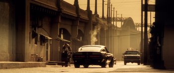 Movie still from “Gone in 60 Seconds” (2000), directed by Dominic Sena – A car that is parked on the side of the street; Wide shot, Low angle