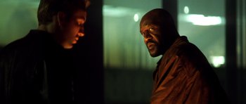 Movie still from “Gone in 60 Seconds” (2000), directed by Dominic Sena – A man and a boy are looking at each other; Close Up shot, Low angle