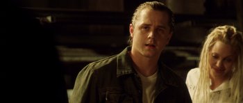 Movie still from “Gone in 60 Seconds” (2000), directed by Dominic Sena – A person wearing a shirt and jacket; Close Up shot, Over the shoulder angle