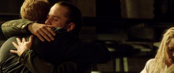 Movie still from “Gone in 60 Seconds” (2000), directed by Dominic Sena – A man in a black jacket is holding a gun; Close Up shot, Over the shoulder angle