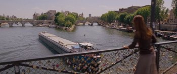 Movie still from “To the Wonder” (2012), directed by Terrence Malick – A view of a river with a bridge in the background; Extreme Wide shot, High angle