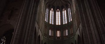 Movie still from “To the Wonder” (2012), directed by Terrence Malick – A large cathedral like building with many windows; Extreme Wide shot, Low angle