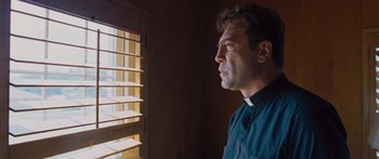 Movie still from “To the Wonder” (2012), directed by Terrence Malick – A man looking out of a window at the sun; Close Up shot, Low angle