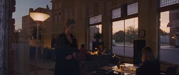Movie still from “To the Wonder” (2012), directed by Terrence Malick – A woman standing in front of a window with candles; Wide shot, Over the shoulder angle