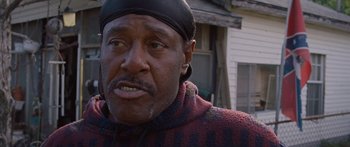 Movie still from “To the Wonder” (2012), directed by Terrence Malick – An older black man wearing a black hat; Close Up shot, Low angle