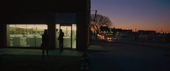 Movie still from “To the Wonder” (2012), directed by Terrence Malick – A fire hydrant in front of a building at night; Extreme Wide shot, Low angle