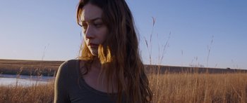 Movie still from “To the Wonder” (2012), directed by Terrence Malick – A woman standing in the middle of an open field; Close Up shot, Low angle