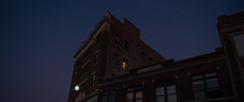 Movie still from “To the Wonder” (2012), directed by Terrence Malick – A building that has been lit up at night time; Extreme Wide shot, Low angle