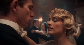 Movie still from “Goodbye Christopher Robin” (2017), directed by Simon Curtis – A man and a woman in front of other people; Close Up shot, Low angle