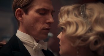 Movie still from “Goodbye Christopher Robin” (2017), directed by Simon Curtis – A man and a woman in formal wear looking at each other; Close Up shot, Low angle