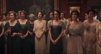Movie still from “Goodbye Christopher Robin” (2017), directed by Simon Curtis – A group of women standing next to each other in a room; Medium shot, Low angle