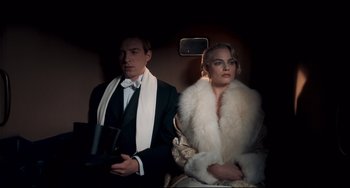 Movie still from “Goodbye Christopher Robin” (2017), directed by Simon Curtis – A man and a woman sitting in a car; Medium shot, Low angle