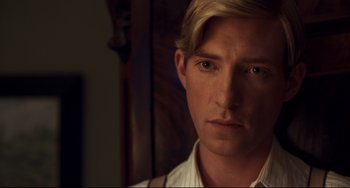 Movie still from “Goodbye Christopher Robin” (2017), directed by Simon Curtis – A person wearing a white shirt; Close Up shot, Over the shoulder angle