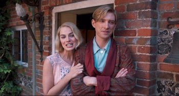 Movie still from “Goodbye Christopher Robin” (2017), directed by Simon Curtis – A man and a woman standing next to each other; Medium shot, Low angle