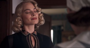 Movie still from “Goodbye Christopher Robin” (2017), directed by Simon Curtis – A woman with blonde hair and eyes closed with eyes closed; Close Up shot, Low angle