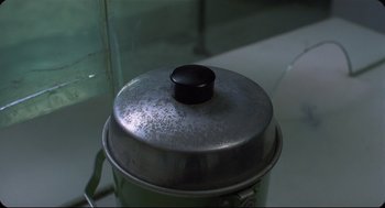 Movie still from “Goodbye, Dragon Inn” (2003), directed by Tsai Ming-liang – The top of a metal container; Extreme Close Up shot, Overhead angle