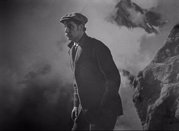 Movie still from “Goodbye, Mr. Chips” (1939), directed by Sam Wood – A black and white photo of a man in a hat; Medium shot, Low angle