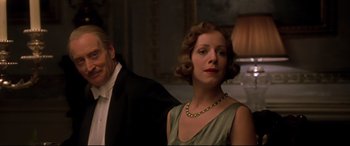Movie still from “Gosford Park” (2001), directed by Robert Altman – A man and a woman standing next to each other in a room; Close Up shot, Low angle