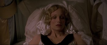 Movie still from “Gosford Park” (2001), directed by Robert Altman – A person laying in a bed; Close Up shot, High angle