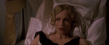 Movie still from “Gosford Park” (2001), directed by Robert Altman – A person wearing a black dress; Close Up shot, High angle