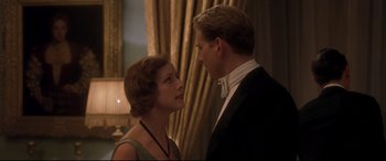 Movie still from “Gosford Park” (2001), directed by Robert Altman – A man and a woman standing next to each other; Medium shot, Low angle