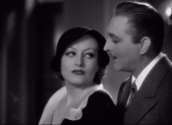 Movie still from “Grand Hotel” (1932), directed by Edmund Goulding – An old photo of a man and a woman; Close Up shot, High angle