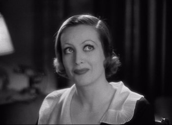 Movie still from “Grand Hotel” (1932), directed by Edmund Goulding – An old photo of an older woman in a black and white photo; Close Up shot, High angle