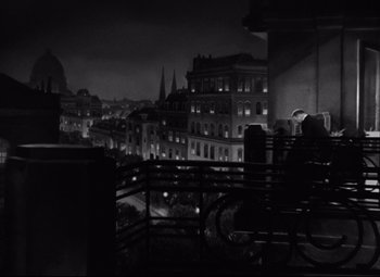 Movie still from “Grand Hotel” (1932), directed by Edmund Goulding – A black and white photo of a city at night; Extreme Wide shot, High angle