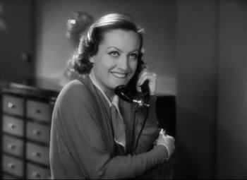 Movie still from “Grand Hotel” (1932), directed by Edmund Goulding – An old photo of a woman on the phone; Close Up shot, High angle