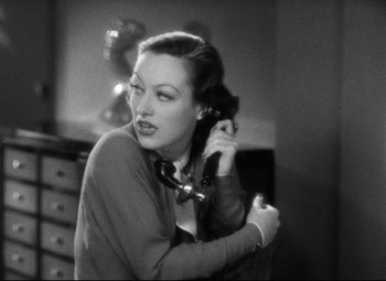 Movie still from “Grand Hotel” (1932), directed by Edmund Goulding – An old photo of a woman talking on a phone; Close Up shot, High angle