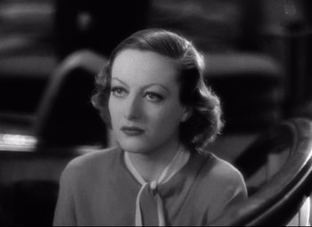 Movie still from “Grand Hotel” (1932), directed by Edmund Goulding – An old black and white photo of a woman with short hair; Close Up shot, High angle