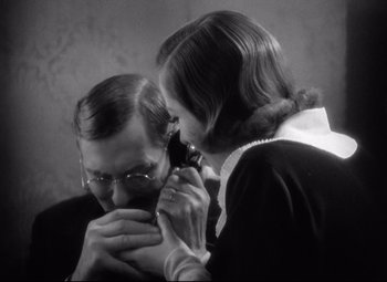 Movie still from “Grand Hotel” (1932), directed by Edmund Goulding – An older man and a young woman looking at each other; Close Up shot, High angle