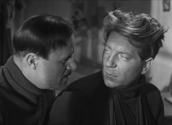 Movie still from “The Grand Illusion” (1937), directed by Jean Renoir – A man and a woman are looking at one another; Close Up shot, Over the shoulder angle