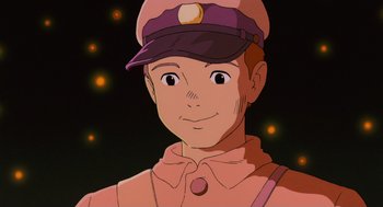 Movie still from “Grave of the Fireflies” (1988), directed by Isao Takahata – A man with a hat is smiling for the camera; Close Up shot, Low angle