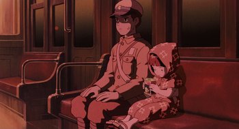 Movie still from “Grave of the Fireflies” (1988), directed by Isao Takahata – A man and a child sitting on a train; Medium shot, High angle