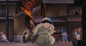 Movie still from “Grave of the Fireflies” (1988), directed by Isao Takahata – An animated picture of a man in a military uniform; Wide shot, High angle