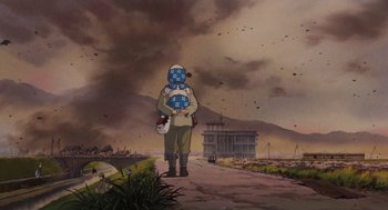 Movie still from “Grave of the Fireflies” (1988), directed by Isao Takahata – A man with a face mask is standing in the middle of a road; Wide shot, Low angle