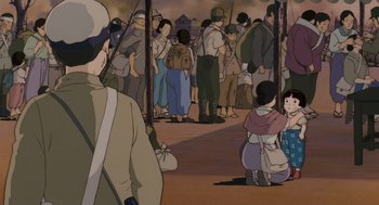 Movie still from “Grave of the Fireflies” (1988), directed by Isao Takahata – A group of people standing in front of each other; Wide shot, High angle