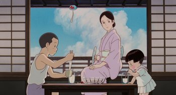 Movie still from “Grave of the Fireflies” (1988), directed by Isao Takahata – A painting of a woman sitting on a park bench with two children; Medium shot, Low angle