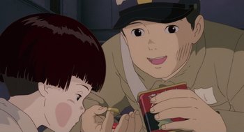 Movie still from “Grave of the Fireflies” (1988), directed by Isao Takahata – An animated picture of a boy and a girl eating food; Extreme Close Up shot, High angle