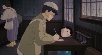Movie still from “Grave of the Fireflies” (1988), directed by Isao Takahata – An animated scene of a man writing on a girl's face; Medium shot, Over the shoulder angle