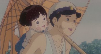 Movie still from “Grave of the Fireflies” (1988), directed by Isao Takahata – An animated picture of a boy and a girl holding an umbrella; Close Up shot, Low angle